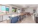 Bright kitchen boasts granite counters, stainless appliances, island with breakfast bar and eat in kitchen table at 557 S Lemon Ct, Gilbert, AZ 85296