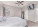 Spacious main bedroom with TV and access to bathroom at 557 S Lemon Ct, Gilbert, AZ 85296