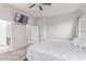 Bright main bedroom with TV and access to main bathroom at 557 S Lemon Ct, Gilbert, AZ 85296
