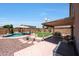Private backyard featuring sparkling pool, covered patio, and a lush lawn at 5744 E Jacaranda St, Mesa, AZ 85205