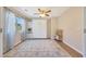 Bedroom with wood floors, a ceiling fan, a window and a built-in Murphy bed at 5744 E Jacaranda St, Mesa, AZ 85205