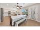 Spacious dining room and kitchen with stainless steel appliances and view of the pool at 5744 E Jacaranda St, Mesa, AZ 85205
