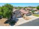 Beautiful two-story home with a three-car garage, set in a quiet neighborhood with mountain views at 5744 E Jacaranda St, Mesa, AZ 85205