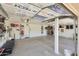 Spacious garage with installed insulated door, clean concrete floor, and storage at 5744 E Jacaranda St, Mesa, AZ 85205