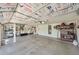 Spacious garage with installed insulated door, clean concrete floor, and storage at 5744 E Jacaranda St, Mesa, AZ 85205