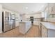 Bright and airy kitchen with an island, stainless steel appliances, and ample counter space at 5744 E Jacaranda St, Mesa, AZ 85205