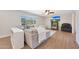 Living room with wood floors, large window, and comfortable seating at 5744 E Jacaranda St, Mesa, AZ 85205