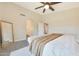 A relaxing main bedroom with natural light, ceiling fan, and neutral tones at 5744 E Jacaranda St, Mesa, AZ 85205