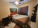 Bedroom with desk, area rug, and art at 5801 N 73Rd Ave, Glendale, AZ 85303