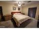 Comfortable bedroom with a queen-sized bed, matching nightstands, and warm, inviting decor at 5801 N 73Rd Ave, Glendale, AZ 85303