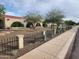 Charming home featuring a brick facade, arched entryways, desert landscaping, and a decorative wrought iron fence at 5801 N 73Rd Ave, Glendale, AZ 85303