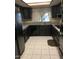 Efficient kitchen with black appliances, dark cabinetry, and granite countertops at 5801 N 73Rd Ave, Glendale, AZ 85303