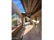 Covered patio featuring brick columns and arched openings with decorative wrought iron accents at 5801 N 73Rd Ave, Glendale, AZ 85303