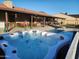 Relaxing backyard with pool, hot tub, covered patio, and outdoor seating areas at 5801 N 73Rd Ave, Glendale, AZ 85303