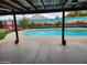 Refreshing pool area with an Arizona desert themed mural, outdoor seating, and artificial turf at 5801 N 73Rd Ave, Glendale, AZ 85303