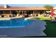 Beautiful backyard with pool, covered patio, comfortable seating, and lush landscaping at 5801 N 73Rd Ave, Glendale, AZ 85303