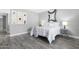 Inviting bedroom features gray walls, modern decor, gray flooring, and a well-lit ambiance at 5813 W Gelding Dr, Glendale, AZ 85306