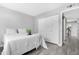 Inviting bedroom showcasing ample closet space and gray vinyl flooring at 5813 W Gelding Dr, Glendale, AZ 85306