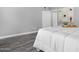 Inviting bedroom features gray walls, modern decor, gray flooring, and a well-lit ambiance at 5813 W Gelding Dr, Glendale, AZ 85306