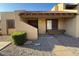 Charming single-story home with a tile roof and desert landscaping in front at 5813 W Gelding Dr, Glendale, AZ 85306