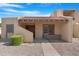 Charming single-story home featuring a tile roof, covered entrance, and desert landscaping at 5813 W Gelding Dr, Glendale, AZ 85306
