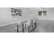 Open-concept living area featuring stylish decor, gray laminate flooring and natural light at 5813 W Gelding Dr, Glendale, AZ 85306