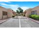 Exterior parking area with desert landscaping providing a tranquil neighborhood setting at 5813 W Gelding Dr, Glendale, AZ 85306