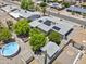 Gorgeous aerial view of the home featuring a refreshing pool and solar panels for energy efficiency at 6263 E Duncan St, Mesa, AZ 85205