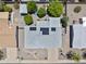 Aerial view of home showcasing solar panels, landscaping, and surrounding neighborhood at 6263 E Duncan St, Mesa, AZ 85205
