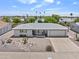 Aerial view of a desert home, featuring low maintenance landscaping and an attached one-car garage at 6263 E Duncan St, Mesa, AZ 85205