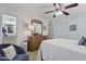 Bright bedroom with a ceiling fan and an ensuite bathroom entrance at 6263 E Duncan St, Mesa, AZ 85205