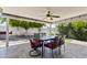Inviting covered patio with ceiling fan and backyard view, creating a comfortable outdoor living space at 6263 E Duncan St, Mesa, AZ 85205