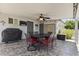 Relaxing covered patio with ceiling fan, perfect for outdoor entertaining and enjoying the weather at 6263 E Duncan St, Mesa, AZ 85205