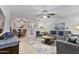 Inviting living room adjacent to the dining area, featuring comfortable seating and ceiling fan at 6263 E Duncan St, Mesa, AZ 85205