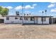 Spacious backyard featuring a covered patio, new paint and ample room for outdoor activities, all under a bright, sunny sky at 7137 N 22Nd Dr, Phoenix, AZ 85021