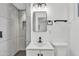 Modern bathroom features sleek vanity, stylish mirror, and tiled shower with modern fixtures, creating a spa-like experience at 7137 N 22Nd Dr, Phoenix, AZ 85021