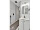 Modern bathroom boasts a tiled shower, stylish vanity, and sleek black fixtures, highlighting contemporary design elements at 7137 N 22Nd Dr, Phoenix, AZ 85021