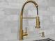 A close up of a decorative gold colored faucet in the beautifully renovated kitchen at 7137 N 22Nd Dr, Phoenix, AZ 85021