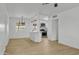 Bright living space with open floor plan featuring modern light fixtures and seamlessly flowing into the upgraded kitchen at 7137 N 22Nd Dr, Phoenix, AZ 85021