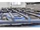 Close-up of stovetop with metal grates and blue flame, showing the cooking features of the kitchen at 7137 N 22Nd Dr, Phoenix, AZ 85021