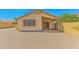 Backyard featuring patio and desert landscaping, providing a private outdoor space at 1048 N Arroya --, Mesa, AZ 85205