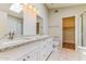 Bright bathroom featuring double sinks with granite countertops and ample cabinet space at 1048 N Arroya --, Mesa, AZ 85205