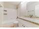 Bright bathroom featuring a granite countertop vanity, shower-tub combination, and vanity mirror at 1048 N Arroya --, Mesa, AZ 85205