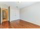 Bedroom with hardwood flooring and natural light from the window and a closet at 1048 N Arroya --, Mesa, AZ 85205