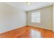 Bedroom featuring natural light from the window and stunning hardwood flooring at 1048 N Arroya --, Mesa, AZ 85205