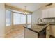 Kitchen nook featuring granite counters, stainless steel dishwasher and a large window at 1048 N Arroya --, Mesa, AZ 85205