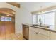 Kitchen area with granite countertops, stainless steel appliances, and open view to the living room at 1048 N Arroya --, Mesa, AZ 85205