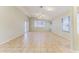 Large living room featuring tile flooring, vaulted ceiling, and sliding glass door to back yard at 1048 N Arroya --, Mesa, AZ 85205