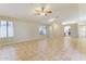 Open-concept living area featuring tile floors, neutral paint, and a ceiling fan at 1048 N Arroya --, Mesa, AZ 85205