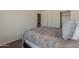 Cozy bedroom showcasing a plush bed, and doors leading to a closet, and an ensuite bathroom at 11101 E Abilene Ave, Mesa, AZ 85208